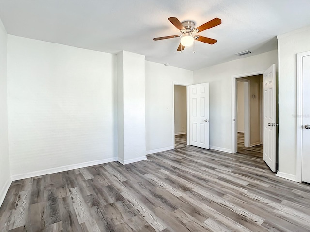 unfurnished room featuring ceiling fan and light wood-type flooring