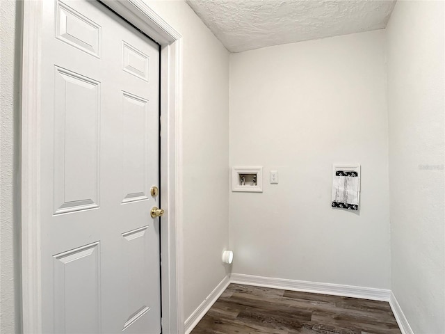 laundry room with hookup for a washing machine, dark hardwood / wood-style floors, and a textured ceiling