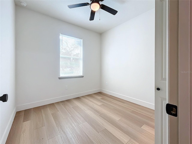 spare room with ceiling fan and light hardwood / wood-style flooring