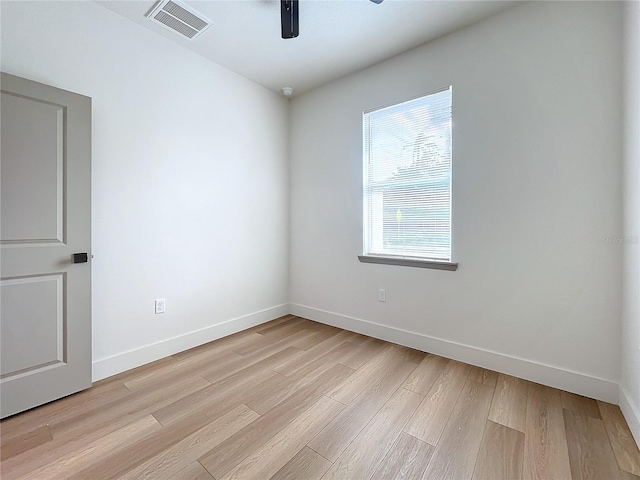 unfurnished room with light hardwood / wood-style flooring and ceiling fan