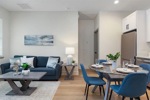 dining area featuring light wood-type flooring