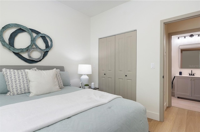 bedroom with a closet and light wood-type flooring