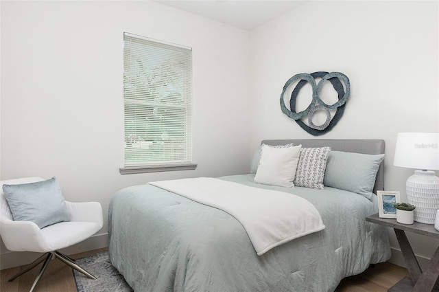 bedroom featuring wood-type flooring