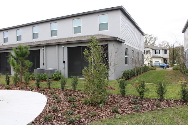 view of front of house featuring a patio area and a front lawn