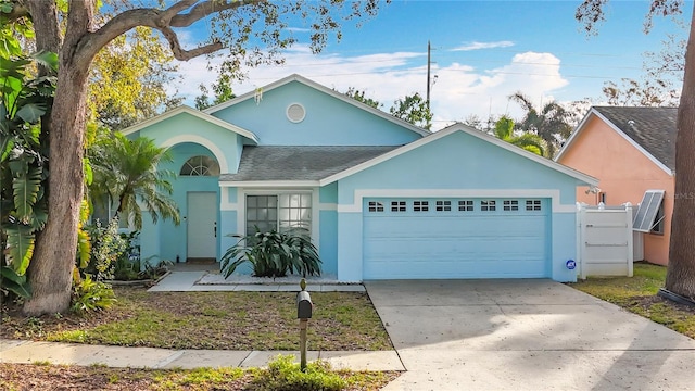 single story home featuring a garage