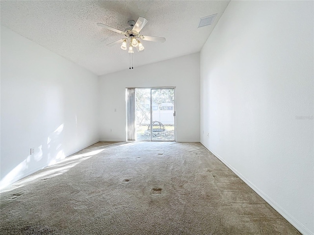 unfurnished room with light carpet, ceiling fan, vaulted ceiling, and a textured ceiling