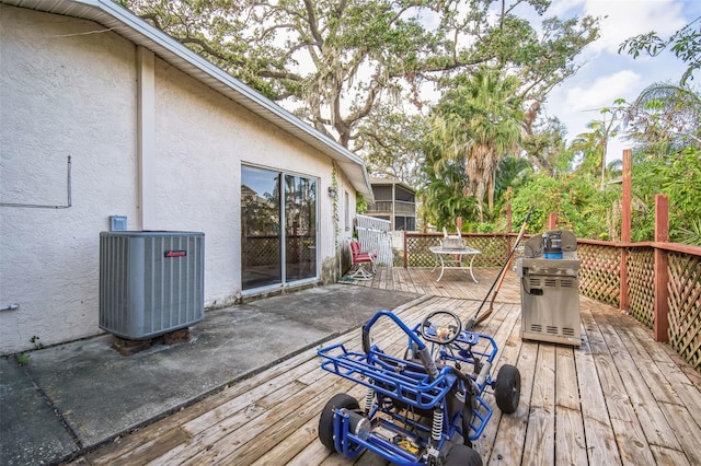 deck with area for grilling and central AC