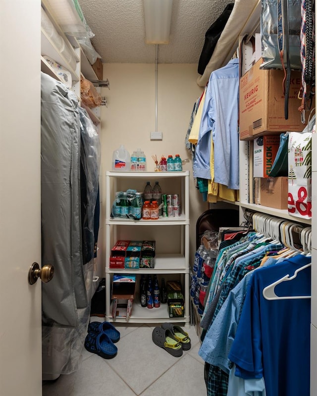 walk in closet featuring tile patterned flooring