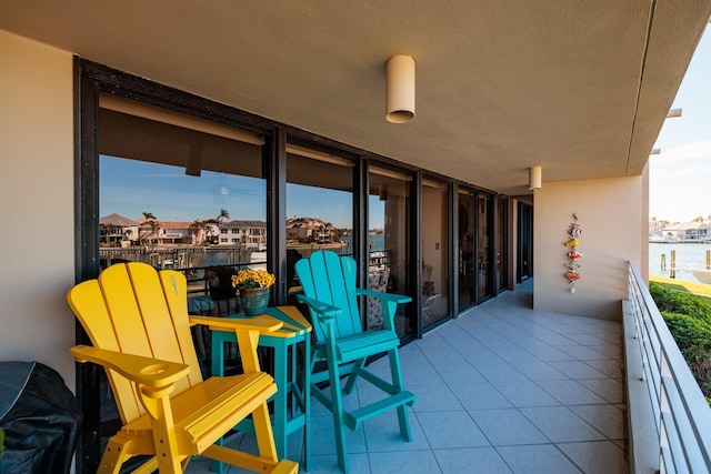 balcony featuring a water view