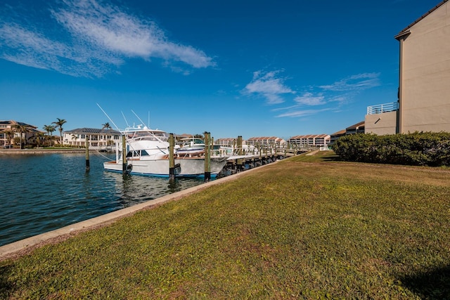 view of dock featuring a water view and a lawn