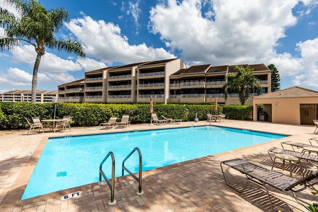 view of swimming pool featuring a patio area