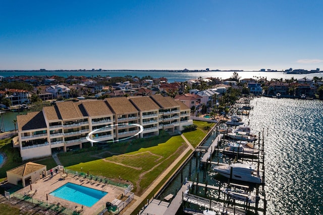 birds eye view of property with a water view