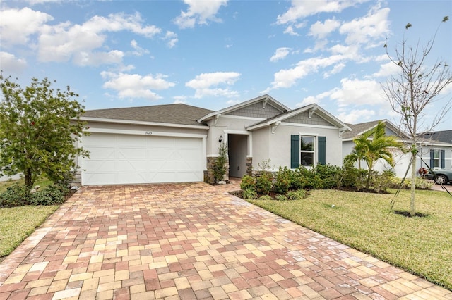 view of front facade featuring a garage and a front lawn