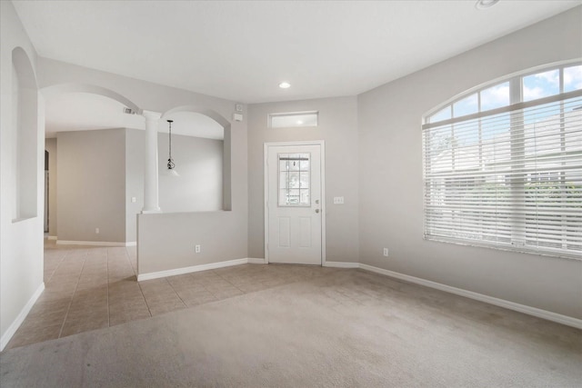 view of carpeted foyer