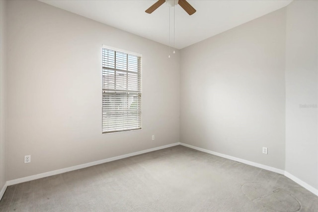 empty room with carpet flooring and ceiling fan