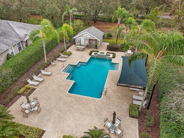 view of pool with an outbuilding, a patio, and a gazebo