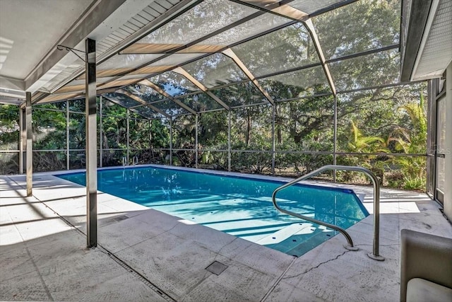 view of swimming pool with a lanai and a patio area