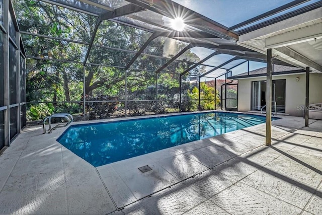 view of pool featuring a lanai and a patio area