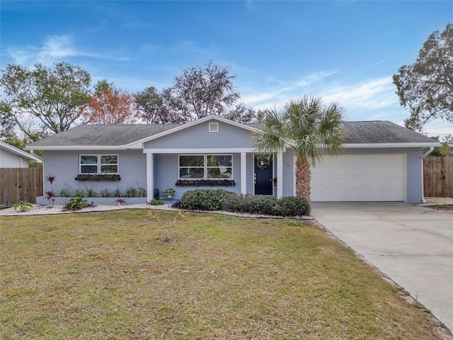 single story home featuring a garage and a front yard