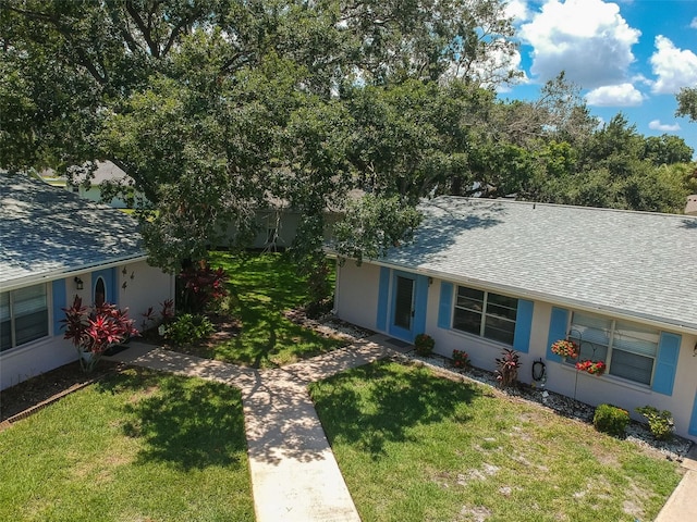 view of front of home with a front lawn