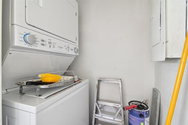 laundry room featuring stacked washer / dryer