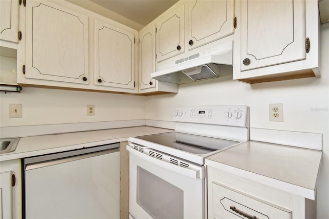 kitchen featuring dishwasher and white range with electric cooktop