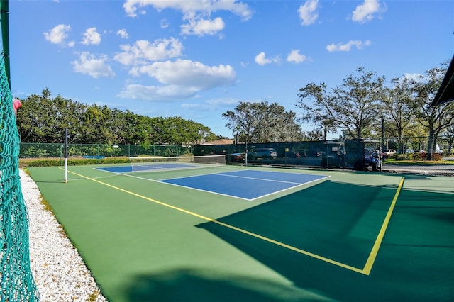 view of tennis court featuring basketball court