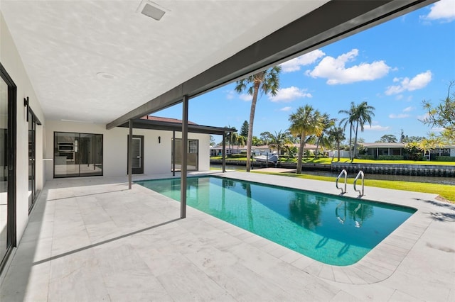 view of pool with a patio