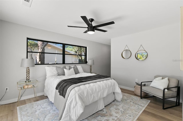 bedroom featuring ceiling fan and wood-type flooring