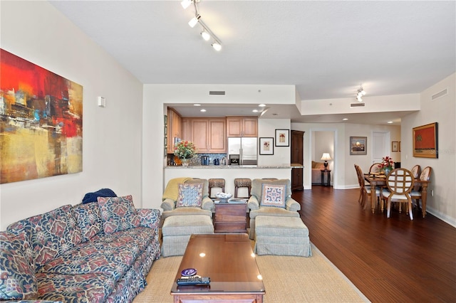 living room featuring dark wood-type flooring