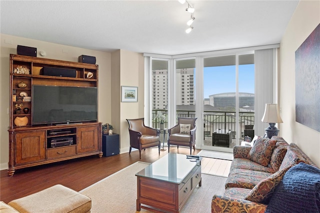 living room with expansive windows and dark hardwood / wood-style floors