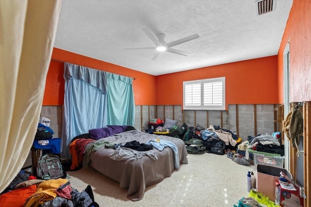 bedroom featuring a textured ceiling and ceiling fan