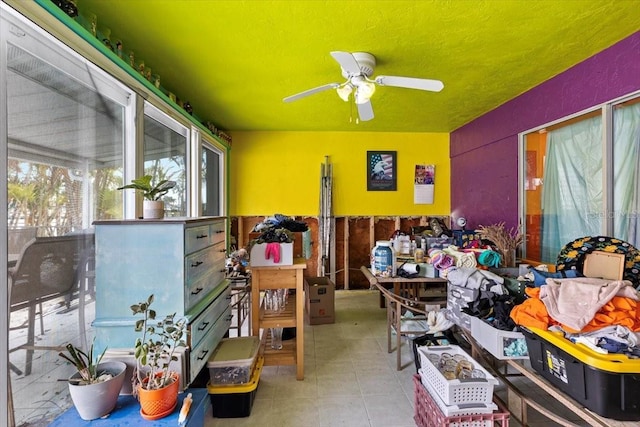 miscellaneous room featuring ceiling fan and light tile patterned floors