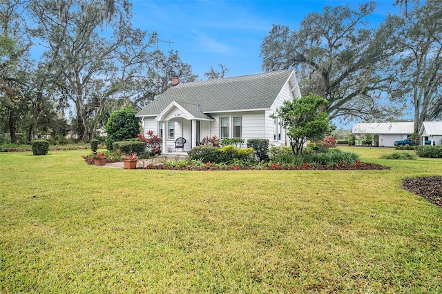 view of front of home with a front lawn