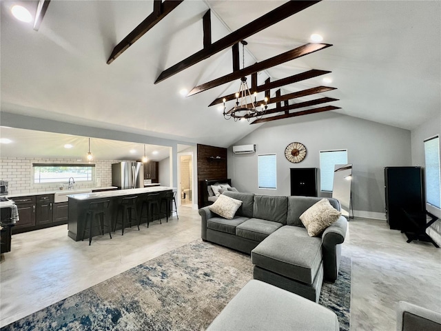 living room featuring sink and lofted ceiling with beams