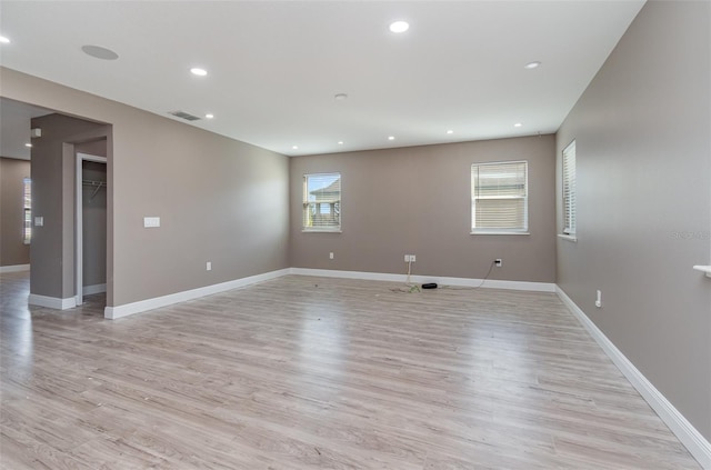 spare room featuring light hardwood / wood-style flooring