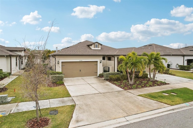 view of front of home with a garage and a front lawn