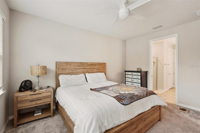 bedroom featuring ceiling fan and light carpet