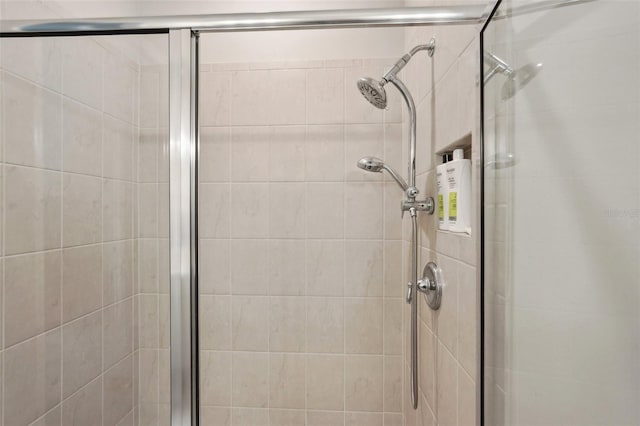 bathroom with a shower with shower door