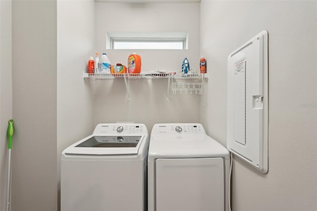 washroom with washing machine and clothes dryer