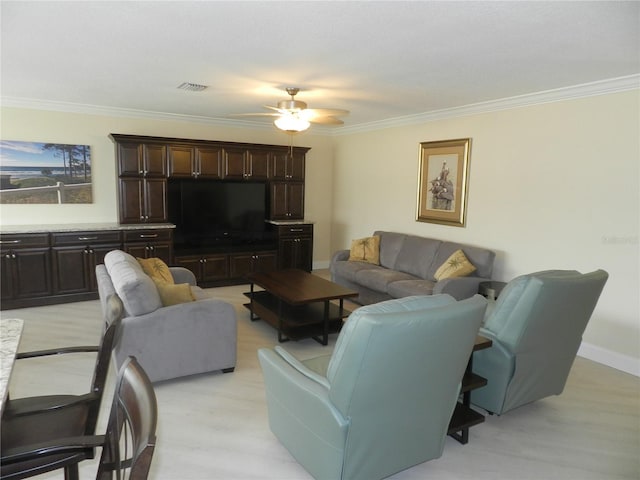 living room featuring crown molding and ceiling fan