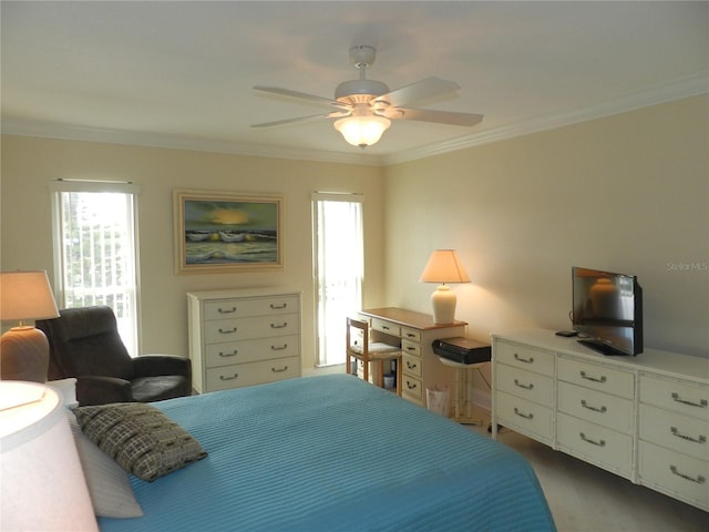 bedroom with ornamental molding and ceiling fan