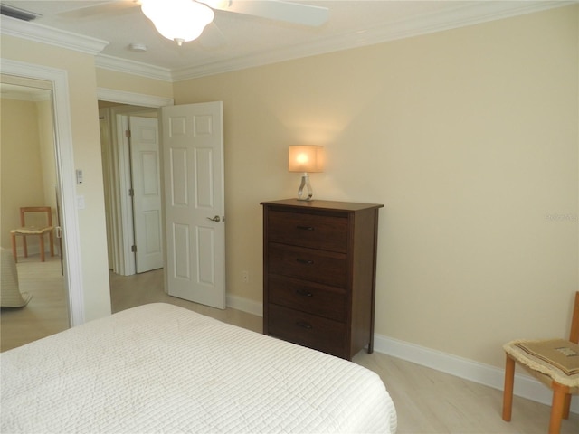 bedroom with ornamental molding and ceiling fan