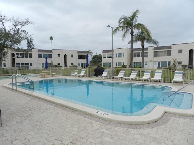 view of swimming pool featuring a patio area