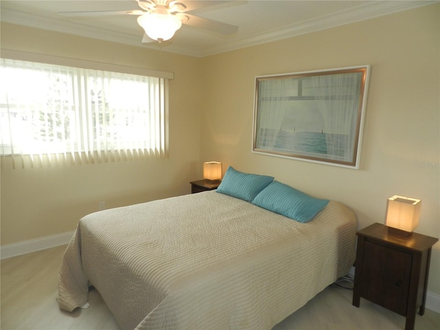 bedroom featuring crown molding and ceiling fan