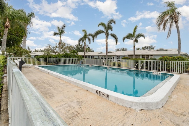 community pool with fence