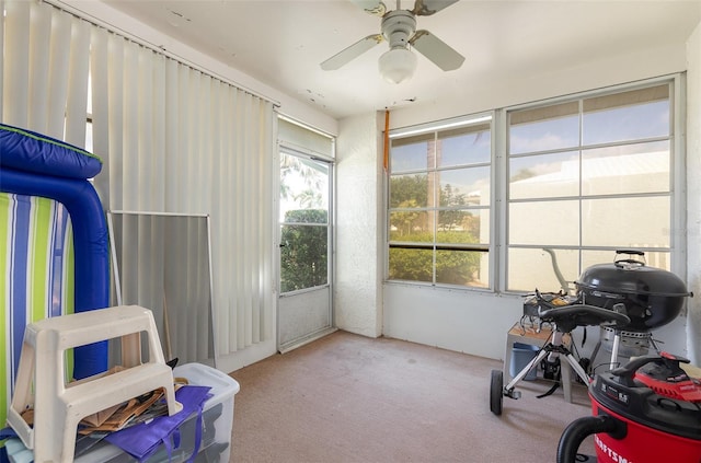 game room with carpet flooring and ceiling fan