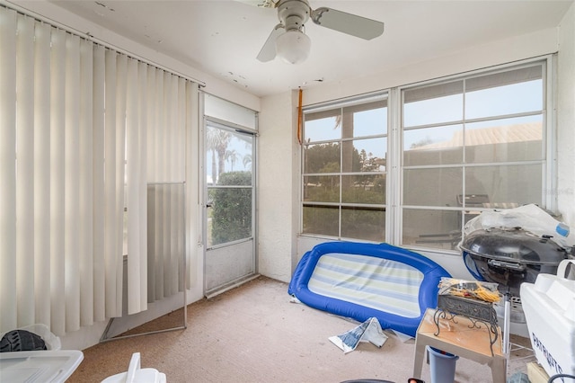 interior space with a ceiling fan