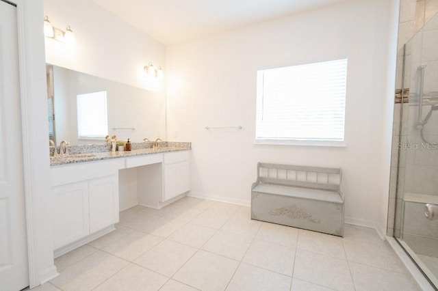 bathroom with vanity, tile patterned floors, and walk in shower