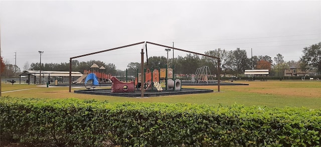 view of jungle gym featuring a lawn